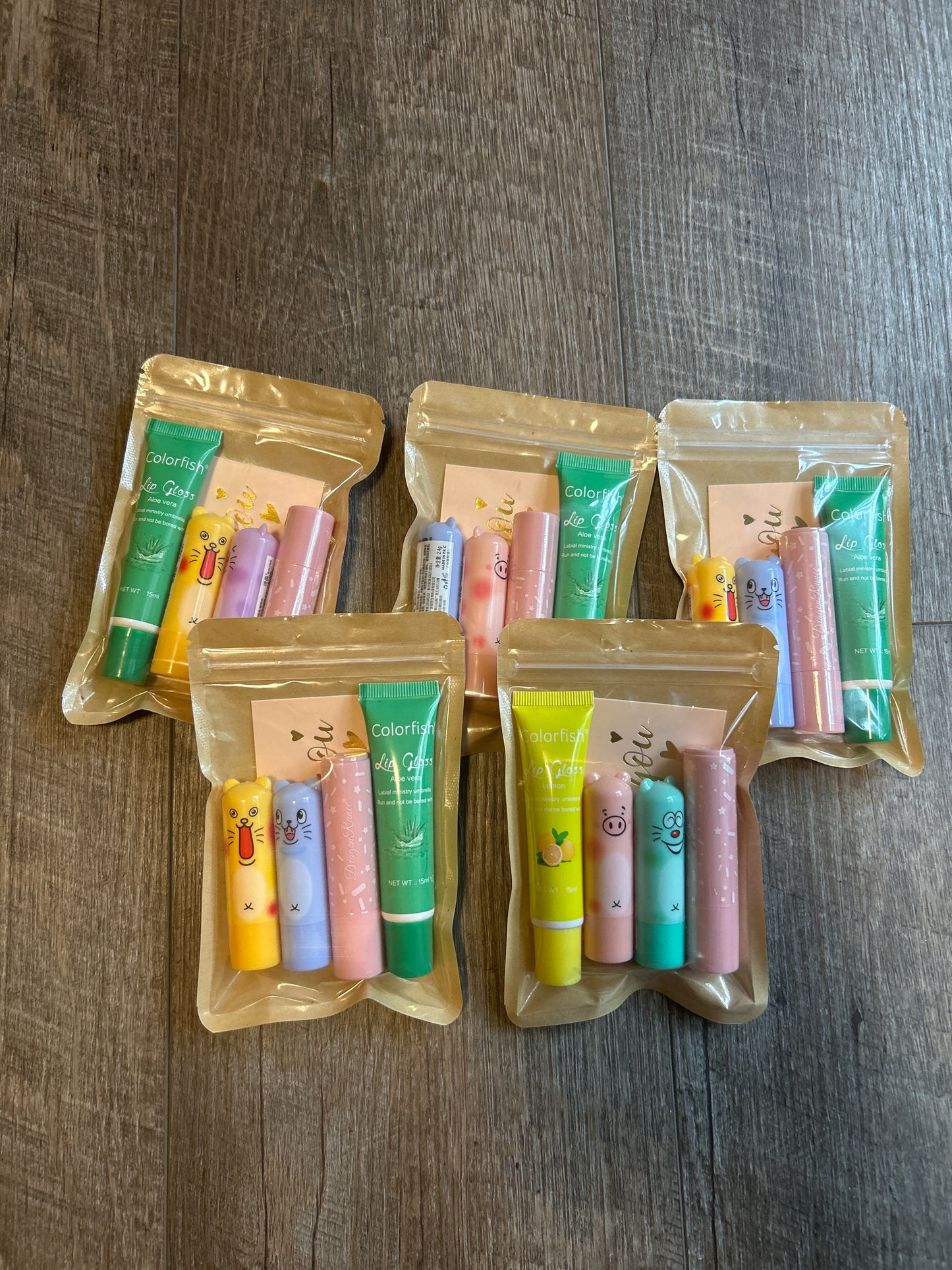 Assorted lip, gloss, and Chapstick